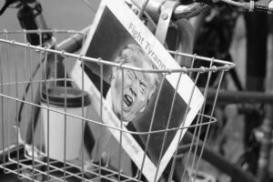 photo of a graphic of an Angry Donald trump in a bike basket