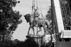 photo of the statue of a confederate soldier on a horse removed from the Charlottesville center
