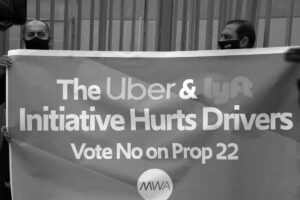 Protestors against Uber holding a big banner